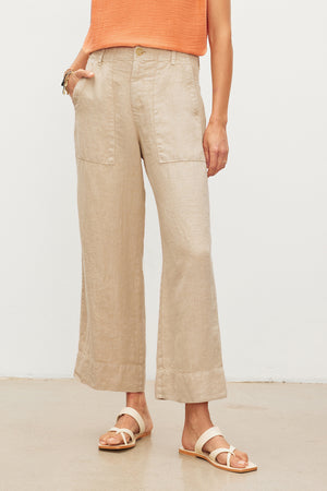 Woman wearing Velvet by Graham & Spencer DRU Heavy Linen Pant with patch pockets and strappy sandals.