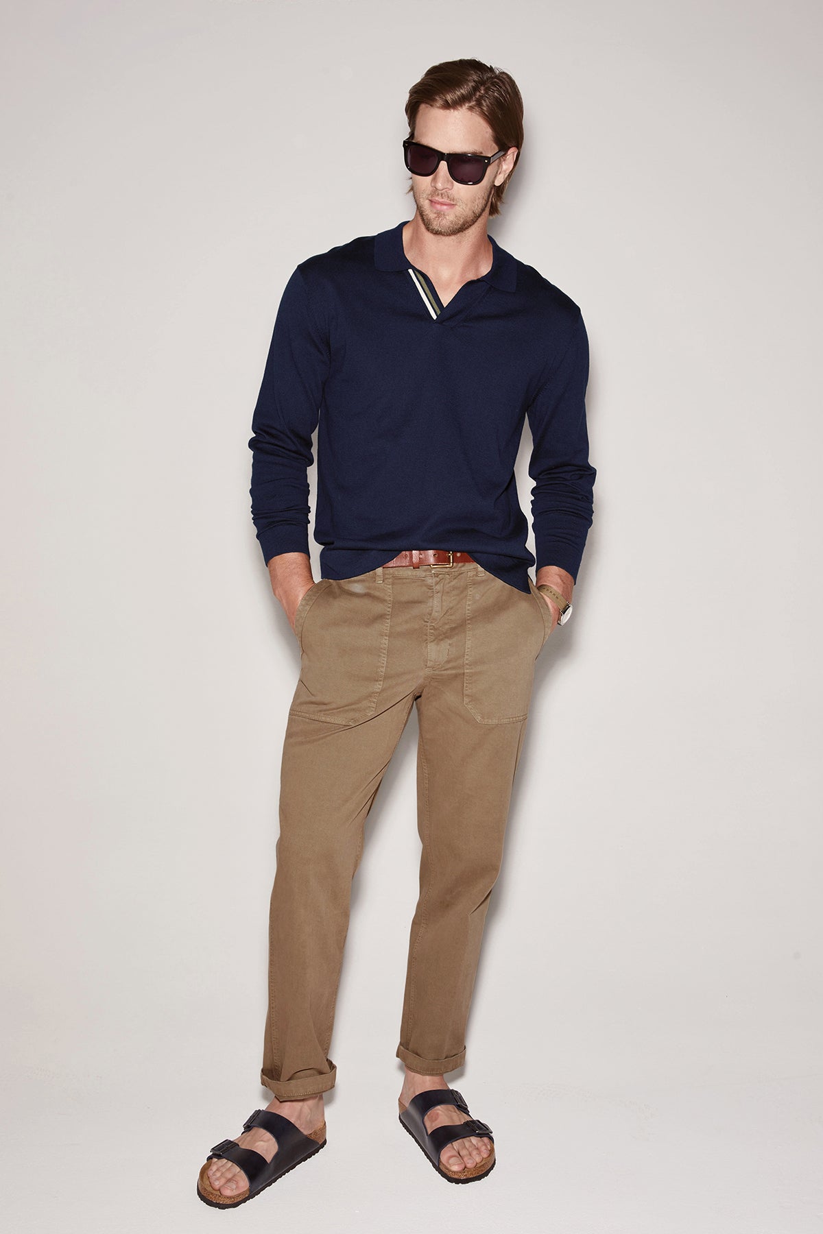 Man in Velvet by Graham & Spencer TOBY SANDED TWILL PANT posing with sunglasses.-36443175780545