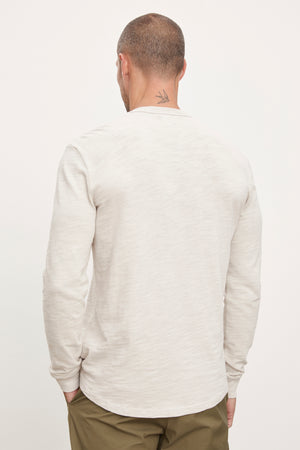 The back view of a man wearing a Velvet by Graham & Spencer PALMER CREW NECK TEE.