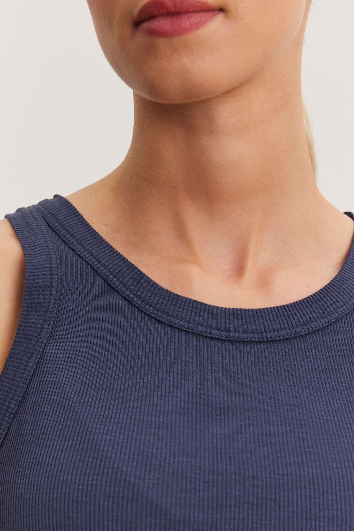 Close-up of a person wearing a Velvet by Graham & Spencer NOLA tank top, focusing on the neckline and collarbones.-36998713704641