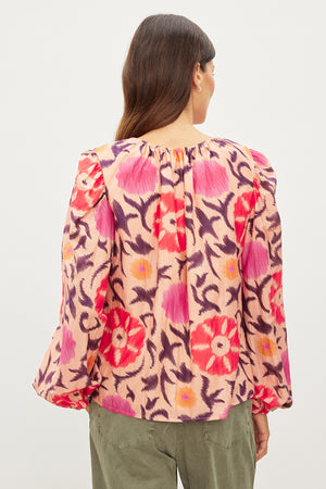 The back view of a woman wearing a Velvet by Graham & Spencer FRASER PRINTED SILK COTTON VOILE TOP.