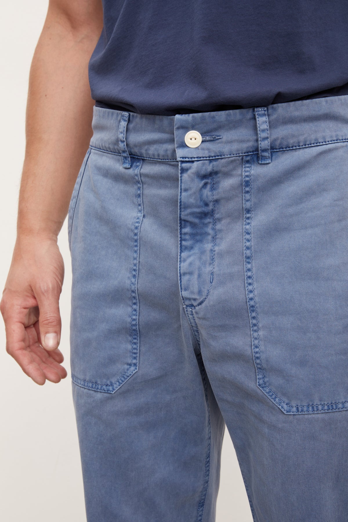   A man wearing Velvet by Graham & Spencer TOBY SANDED TWILL PANT and a t-shirt. 