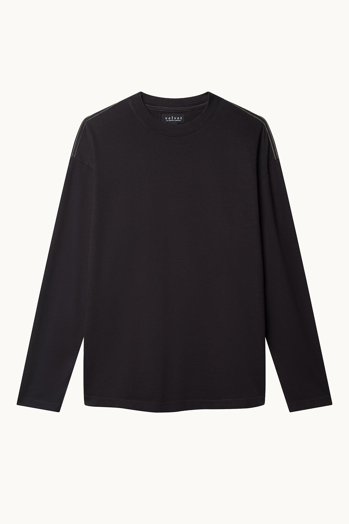   The SLATER TEE by Velvet by Graham & Spencer is a black long-sleeve shirt made from structured pima cotton jersey, featuring a round neckline on a plain white background. Its relaxed fit ensures comfort, making it a versatile wardrobe essential. 