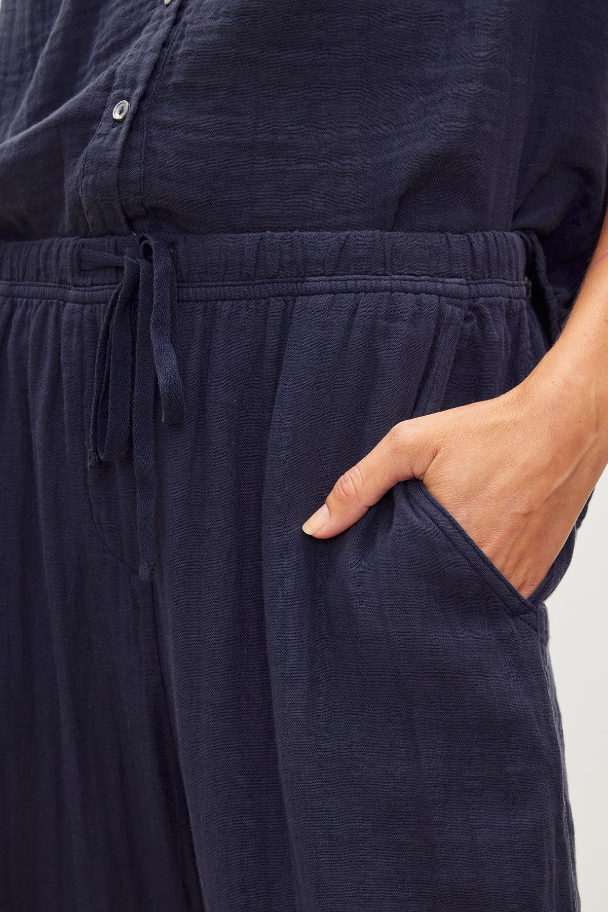   A woman is wearing a pair of FRANNY COTTON GAUZE PANT with pockets. 