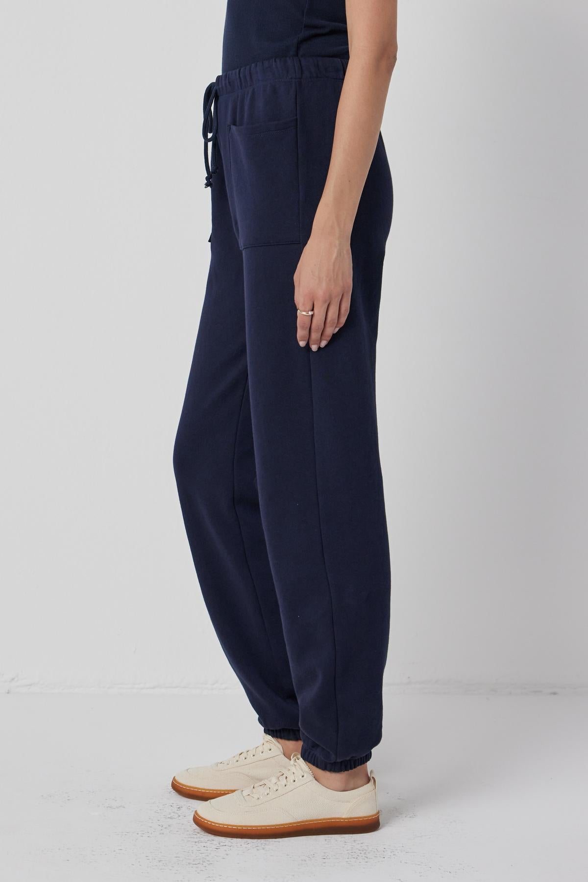   A woman wearing Velvet by Jenny Graham WESTLAKE SWEATPANT and a white t - shirt. 