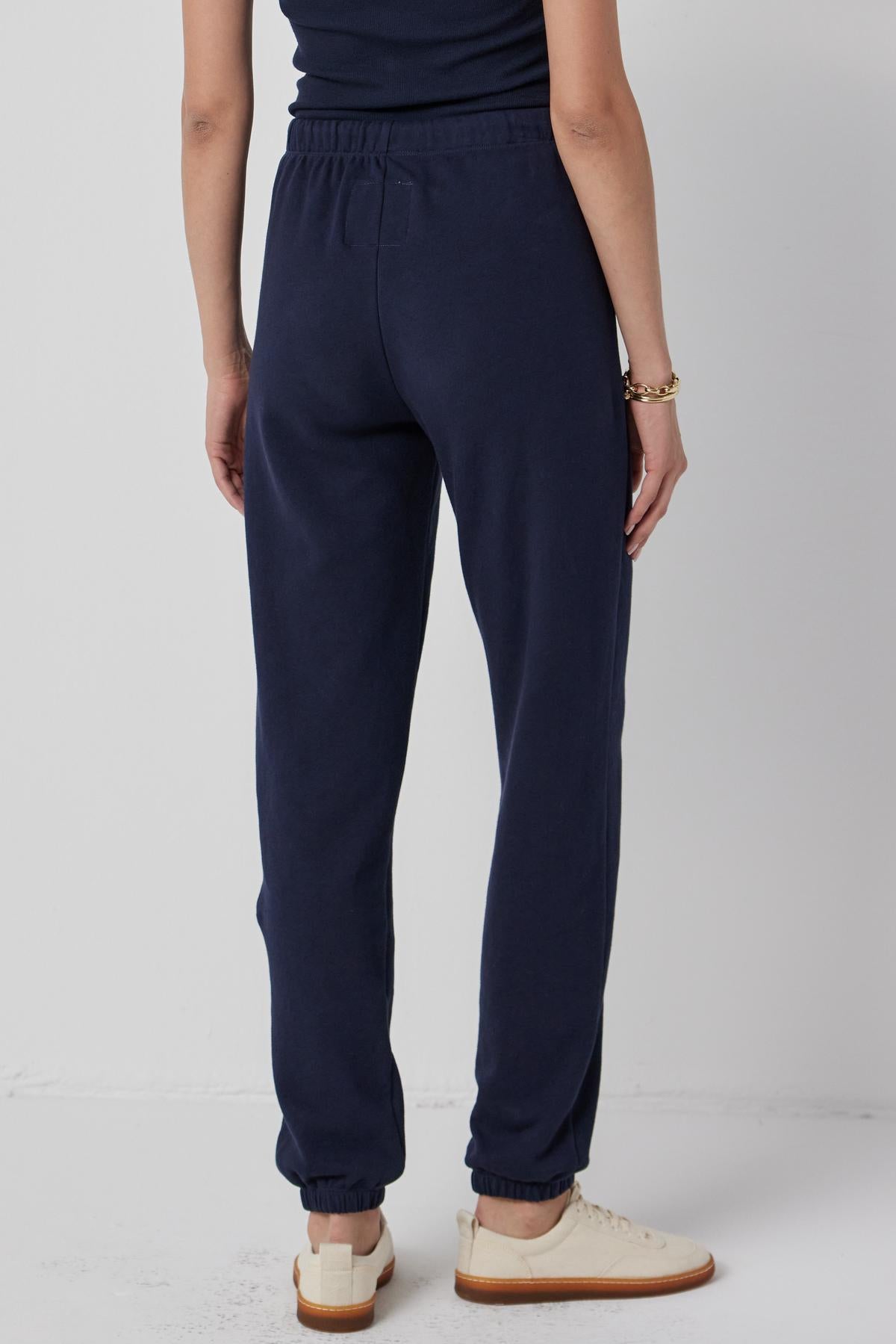   The back view of a woman wearing Velvet by Jenny Graham's WESTLAKE SWEATPANT. 