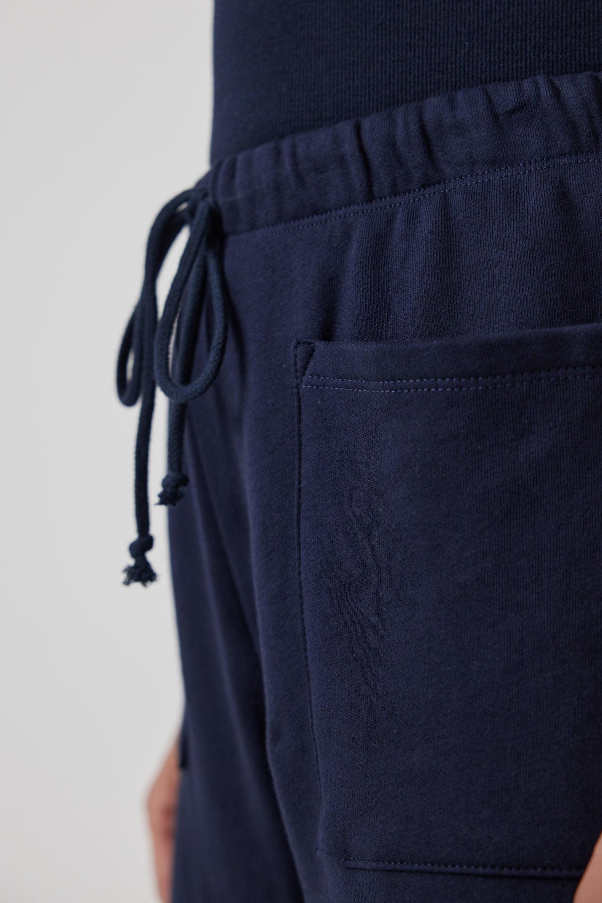   The back pocket of a man's Velvet by Jenny Graham WESTLAKE SWEATPANT. 