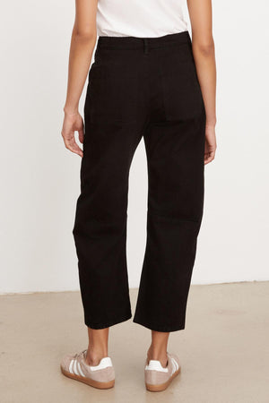 The back view of a woman wearing Velvet by Graham & Spencer BRYLIE SANDED TWILL UTILITY PANT with patch pockets.