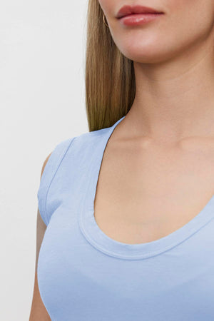 A close-up of a person wearing a Velvet by Graham & Spencer ESTINA TANK TOP, showing their neck and upper chest.