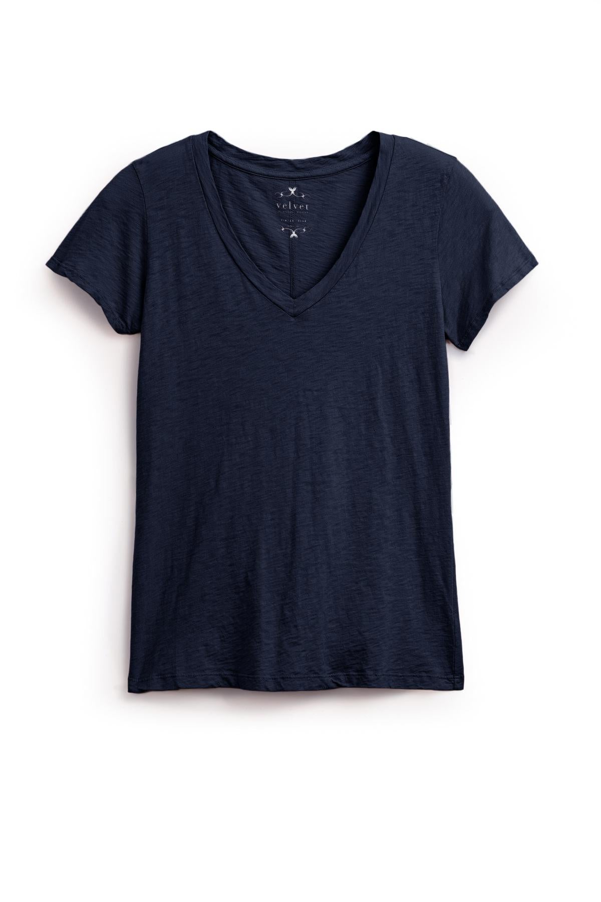   A plain, dark blue LILITH TEE by Velvet by Graham & Spencer made from luxurious cotton slub, featuring short sleeves and a flattering fit, laying flat on a white background. 