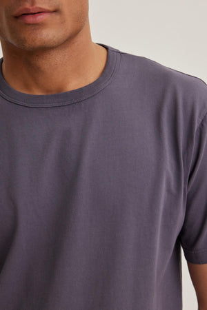 A person wearing the WELLS TEE by Velvet by Graham & Spencer, shown from the shoulders to just above the waist.