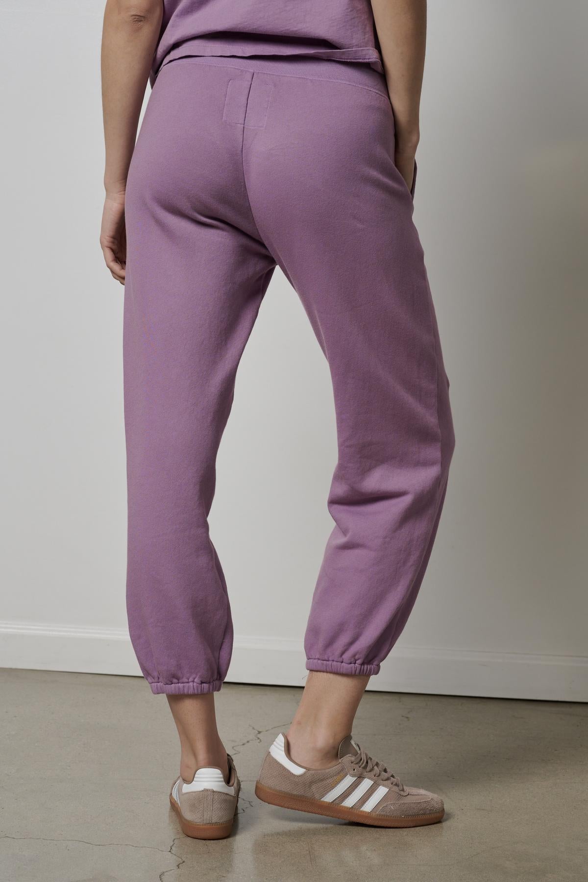   The back view of a woman wearing ZUMA SWEATPANTS by Velvet by Jenny Graham. 