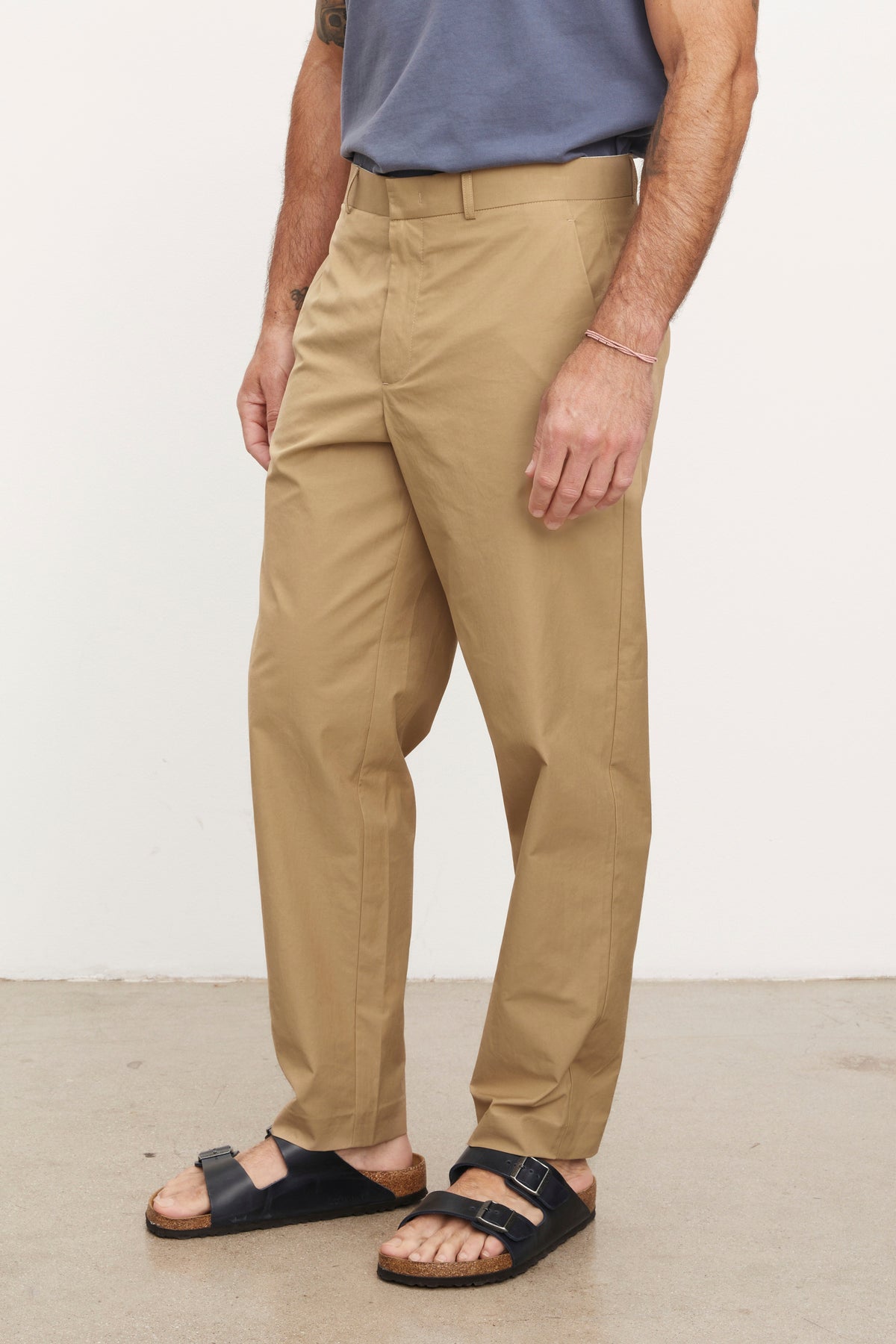 A man wearing Velvet by Graham & Spencer STING POPLIN PANT and sandals.-36009027338433