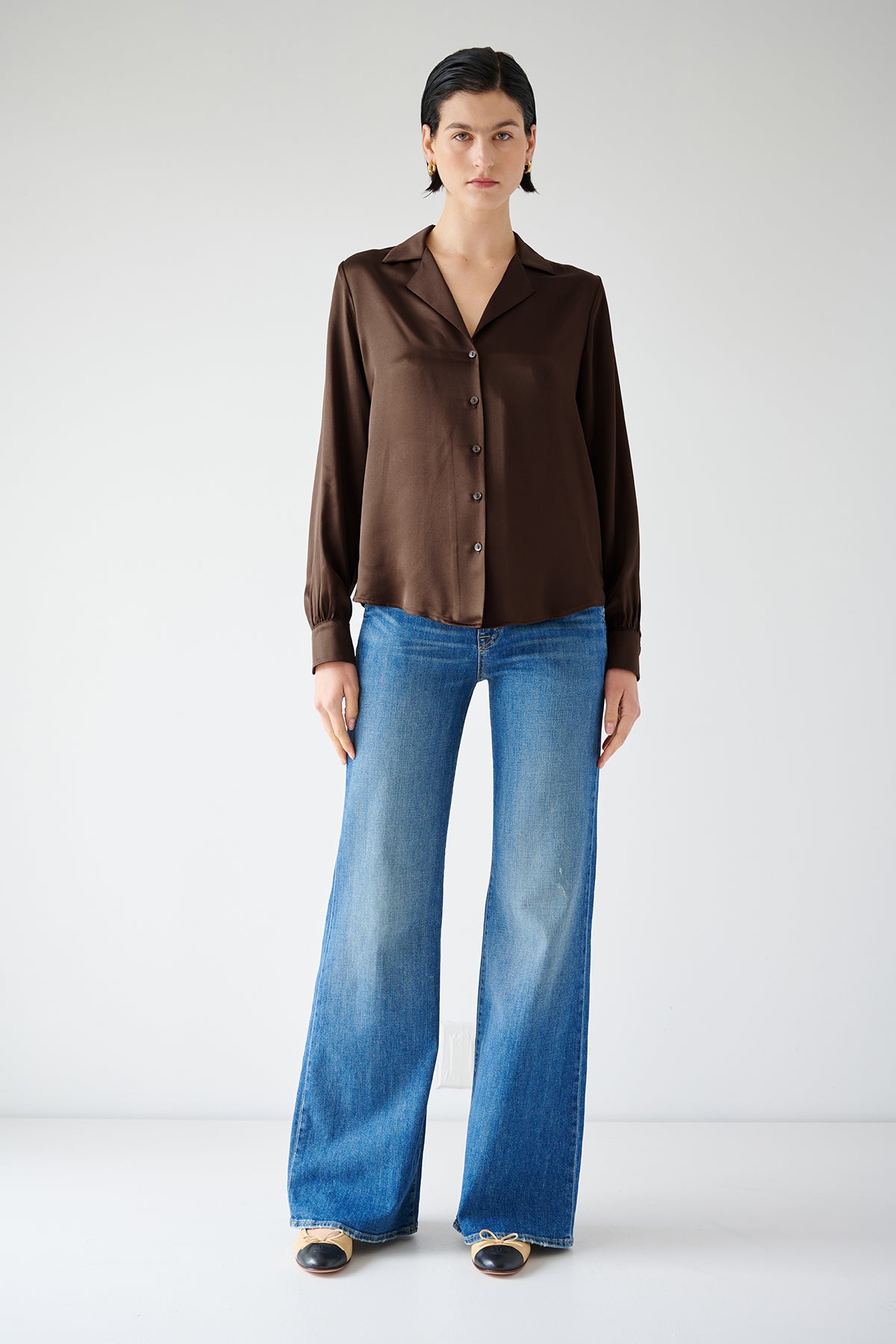   The model is wearing a timeless brown Silk Button-Up Blouse, the SOHO TOP by Velvet by Jenny Graham. 