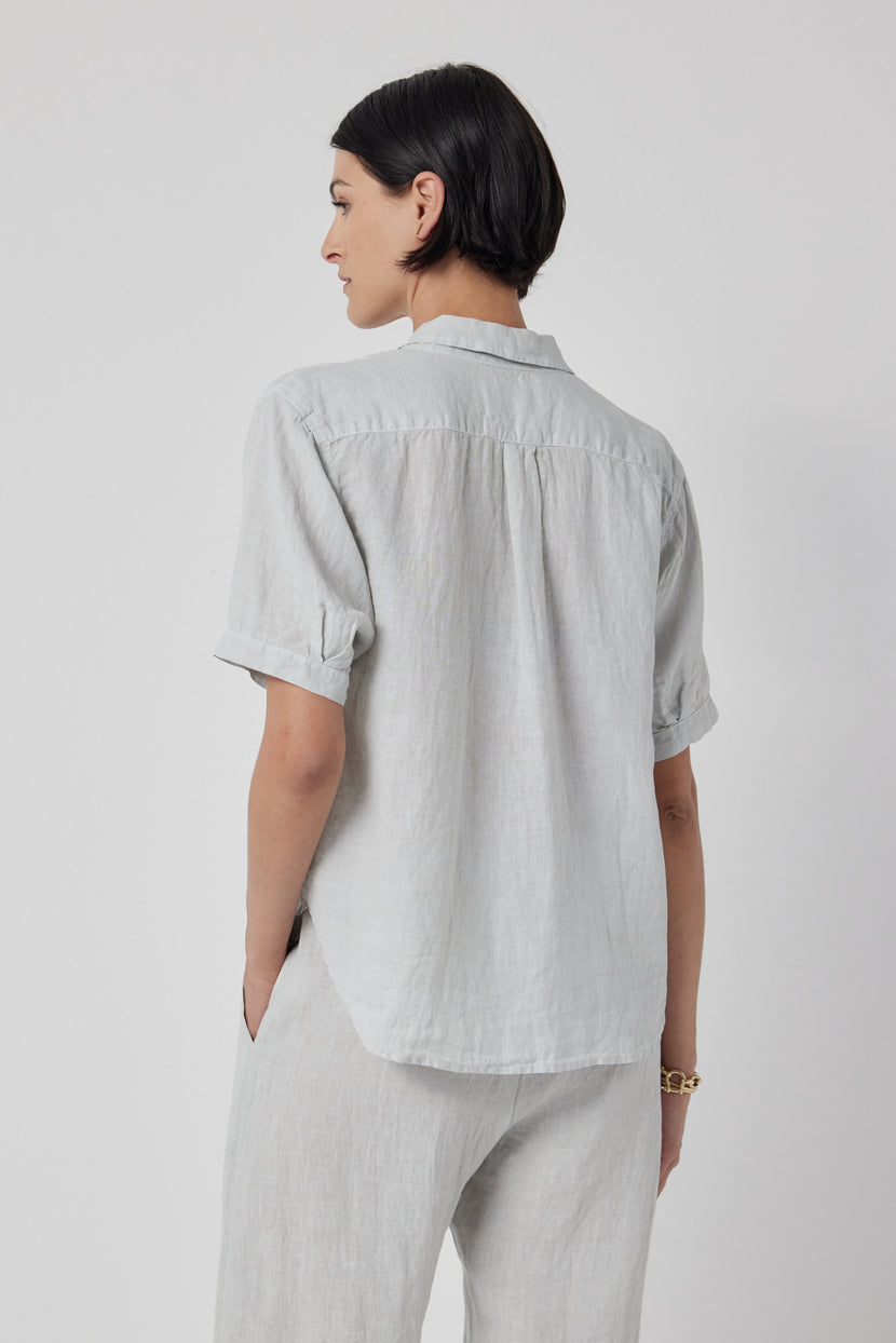 The back view of a woman wearing a Velvet by Jenny Graham CLAREMONT SHIRT.