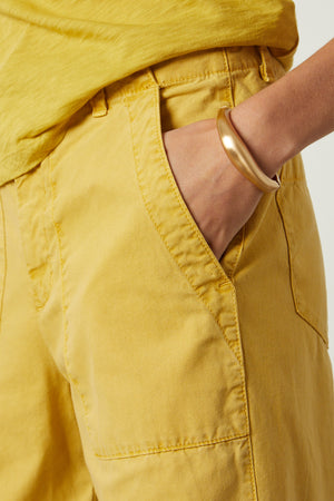 Mya Pant in golden yellow aurora color front pocket detail