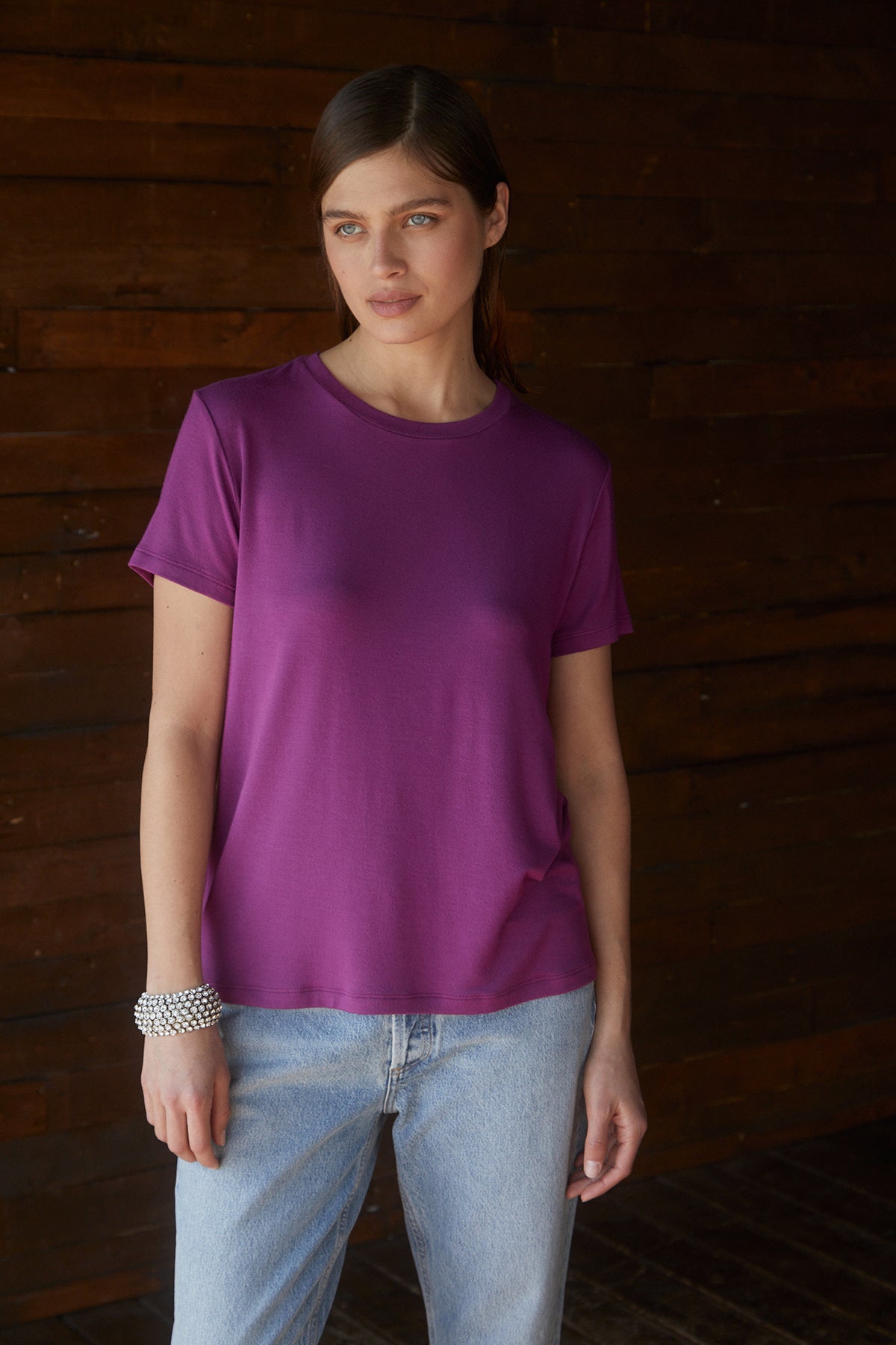   A woman wearing a Velvet by Jenny Graham SOLANA TEE jeans. 