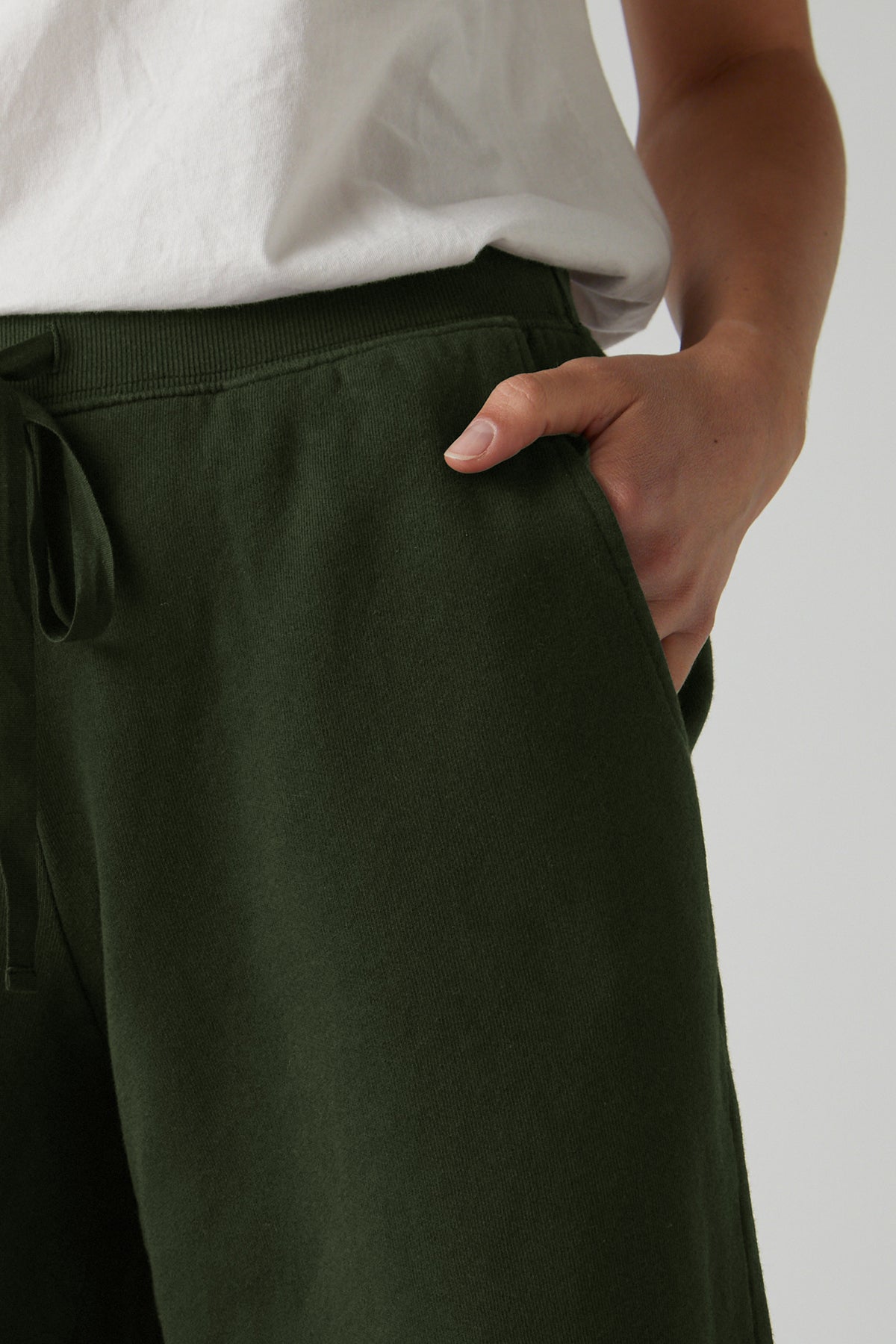   a woman is wearing a pair of green Velvet by Jenny Graham LAGUNA SWEATSHORT. 